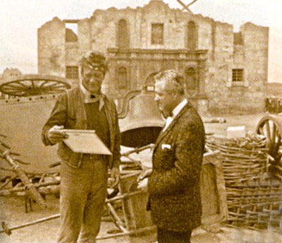 John Wayne and ?? in front of the Alamo replica in Brackettville, TX.
