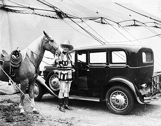 Tom Mix with his palomino Comanche pose next to Tom’s Nash at the Sells-Floto Circus in 1930. Tom toured with the circus from 1929 to 1931 at a reported salary of $20,000 a week. Although Tony was the horse most associated with Tom he often used Comanche for parades and personal appearances. (Thanx to Roy Bonario.) 