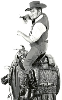 Errol Flynn prepares for one of those phony riding shots in “San Antonio” (‘45 WB). 