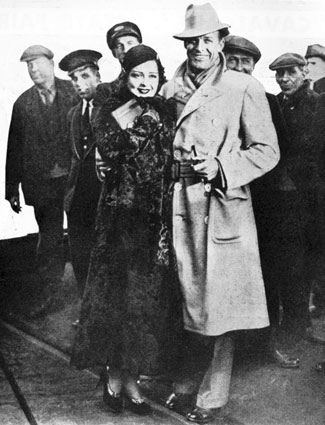 A group of Brits welcome Clara Bow and Rex Bell (Mr. and Mrs.) as they step off the ship in England in early 1933. 