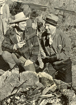 Russell Hayden and producer Harry “Pop” Sherman take a little time off while filming “Heritage of the Desert” in Kernville, CA, in January 1939, to cook up some Mexican tortillas over an open pit fire.