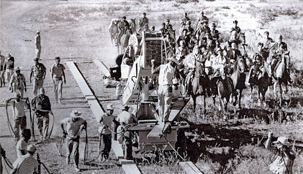 John Wayne as Davy Crockett and Richard Widmark as Jim Bowie ride into the Alamo in a tracking shot from “The Alamo” (‘60). 