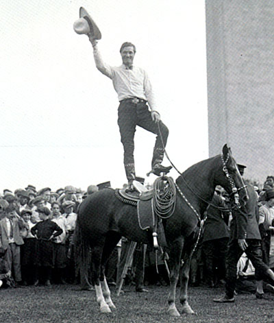 Tom Mix entertains a group of boys with a stunt on Tony on May 21, 1925. 
(Thanx to Greg Parrish.) 