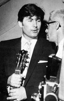 “Davy Crockett”, “Daniel Boone”—Fess Parker, holding his guitar, attends a 
benefit in 1956. 