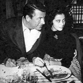 “Empire”—Richard Egan at Guy Madison’s birthday party in 1954 dines with Italian engenue Marisa Pavan, Pier Angeli’s twin sister. 