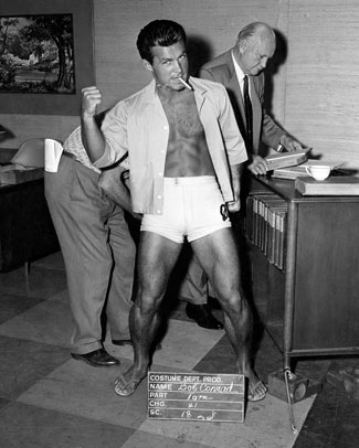 “Wild Wild West”—Robert Conrad poses for a costume department photographer. That’s former stuntman-turned-bit player/extra George DeNormand behind Conrad.