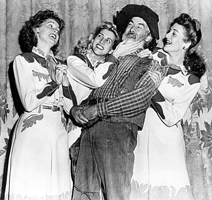 The Andrews Sisters and Gabby Hayes on the Orpheum stage for 
“The Andrews Sisters” radio show. 