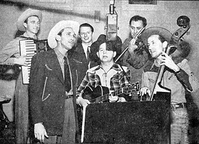 Andy Parker and the Plainsmen. (L-R) George Bamby, Andy Parker, Freddy Haynes, Charley Morgan, Harry Sims and Clem Smith at a Capitol recording session in 1950. Andy and the Plainsmen co-starred in several Jimmy Wakely Monogram Bs. 