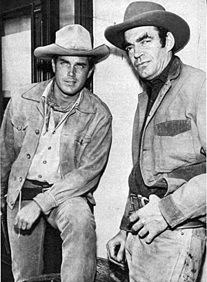 Taking a break from shooting TV’s “Temple Houston” are Jeffrey Hunter
and Jack Elam. 