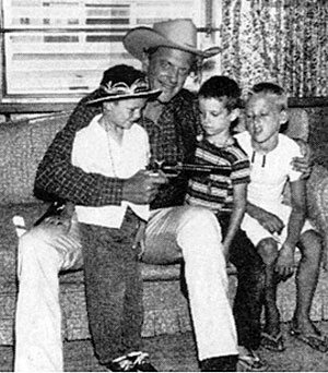 James Arness plays Marshal Dillon with three young boys. 