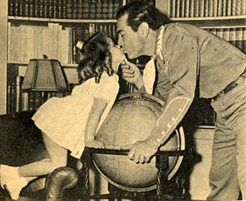 Four and half year old Cynthia gives daddy Johnny Mack Brown a loving kiss. 