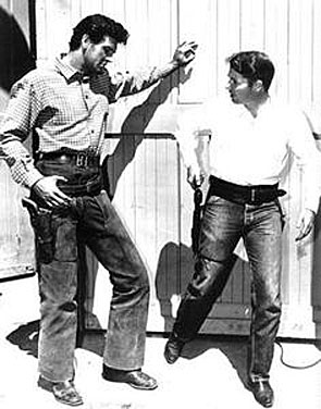 Audie Murphy teaches Rock Hudson the finer points of gun handling on the set of Universal’s “The Lawless Breed” in which Hudson played John Wesley Hardin. 