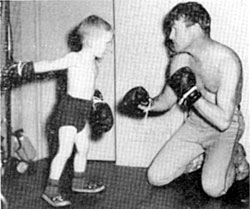 Roy Rogers teaches son Dusty the art of fisticuffs. 