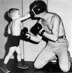 Roy Rogers teaches son Dusty the art of fisticuffs. 