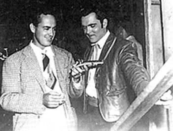 Producer (and former actor) Buddy Rogers and star Richard Martin look over a prop gun used in their “Adventures of Don Coyote” (‘47 Comet/UA).