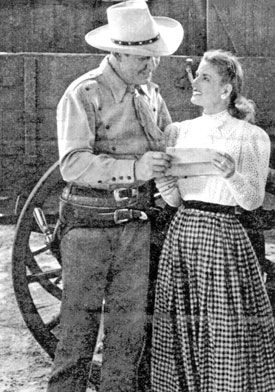 Johnny Mack Brown and leading lady Virginia Belmont look over a script page while filming “Prairie Express” (‘47 Monogram). Virginia also worked with Hopalong Cassidy and Jimmy Wakely and co-starred in the Republic serial “Dangers of the Canadian Mounted” in ‘48. 