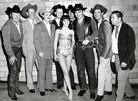 Personal appearance for the St. Louis Police Circus in 1965. (L-R) Sons of the Pioneers: Pat Brady, Lloyd Perryman, Roy Lanham, Rusty Richards, Dale Warren with Candy Cavaretti, James Drury, Jon Locke and John Mitchum. 