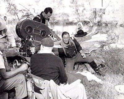 William Holden and John Wayne get last minute directions from director John Ford for a scene in “The Horse Soldiers”. 