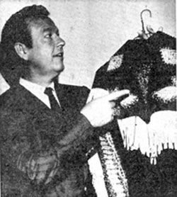 Rex Allen makes ready one of his 10 “wild” shirts as he prepares for his appearance at the New Mexico State Fair in Albuquerque. (9/21/60) 