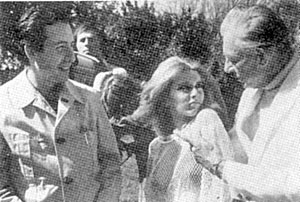 Producer Sam Sherman (left) chats with stars of the “Naughty Stewardesses” (‘74 Independent International) Connie Hoffman and Robert Livingston.