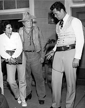 Warner Bros. scriptwriter Marion Hargrove and longtime character actor Bud Osborne watch James “Maverick” Garner practice a gun trick. (Thanx to Terry Cutts.) 