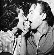 Michael (“Law of the Plainsman”) Ansara shares an apple with date Beverly Garland. 