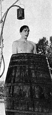 “It’s hot out there in the desert making them Hopalong Cassidy movies,” sez Russell Hayden as he cools off in a makeshift shower. 