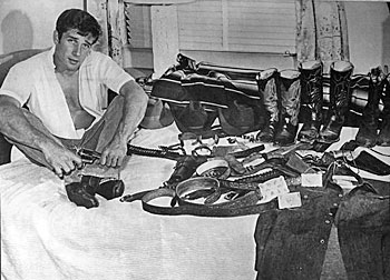Robert Fuller and a vast array of his guns, boots, chaps, belts, etc.