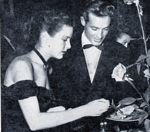 Guy (“Wild Bill Hickok”) Madison out on the town for dinner with date 
Cathy Downs in 1947. 