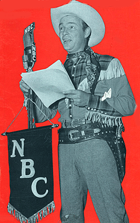 Roy Rogers reads script on his NBC radio program. 