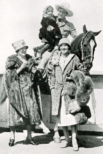 Tom Mix on Tony with his daughter. Beside them Tom's mother (left) and wife (right).