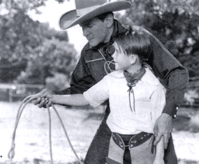 Buck Jones teaches young Dick Jones a few rope tricks during the making of “Hollywood Roundup” (‘37 Columbia). (Courtesy Ann Snuggs.) 
