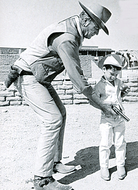 John Wayne with son Ethan on the set of “El Dorado” (‘67 Paramount). 