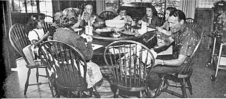 Mealtime with the Rogers family at a table made by George Montgomery. 