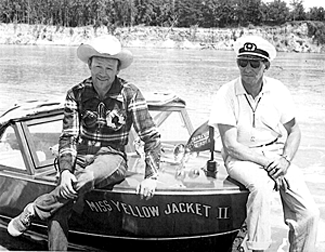 Roy with ?? relax on one of Roy’s boats. 