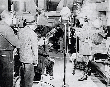 Director George Nicholls Jr. lines up a shot with Richard Dix for “Man of Conquest” (‘39 Republic). 