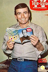 “The Virginian” James Drury looks over a Spanish version of TV GUIDE
in April of 1967. 