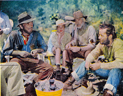 While filming “Treasure of Sierra Madre”, having lunch together are Humphrey Bogart, hairdresser Betty Lou Delmont, Walter Huston and Tim Holt. 