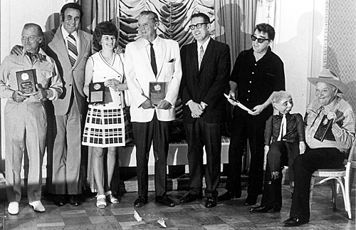 Gathered at an early Memphis Film Festival are Don Barry, Sunset Carson, unknown, Russell Hayden, panel moderator Jim Shoenberger, Lash LaRue, Max Terhune and Elmer. 