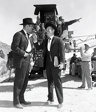 Burt Lancaster and Kirk Douglas chat during a break in filming “Gunfight at O.K. Corral” at Old Tucson in 1957.