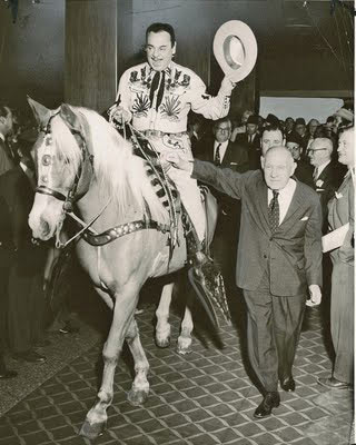 Leo Carrillo, TV's Pancho on “The Cisco Kid”, and his horse Conquistador ride into the foyer of the Sherman-Ambassador hotel in Chicago on December 5, 1957, for the 45th Annual Convention of the Showman’s League of America. Beside Carrillo is hotel board chairman Frank W. Bering, a livelong friend of Leo’s.