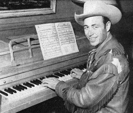 Eddie Dean at the piano composing another tune in 1952. 