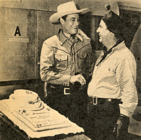 In late 1949 Charles Starrett congraulates Smiley Burnette on his 15th year in movies.