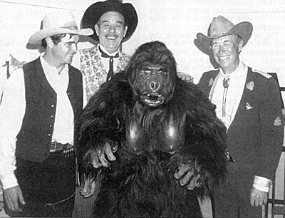 Buck Taylor, Glenn Strange, Bob Burns as Kogar the Gorilla and Eddie Dean at the Burbank on Parade event in 1968. 
