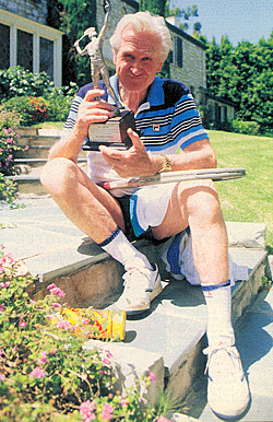 Lloyd (“High Noon”, TV’s “The Loner”) Bridges home at 80 with one of his tennis trophies in 1993. 