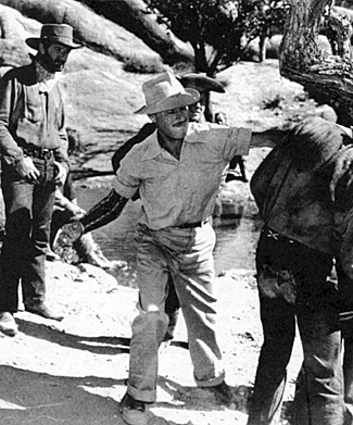 Director Wild Bill Wellman demonstrates how to throw a movie punch during the filming of “Yellow Sky” in 1947. 