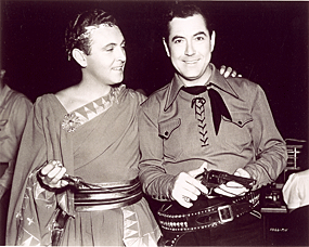 When Allan Jones visited Johnny Mack Brown on the set of “Bad Man from Red Butte” (‘40), he compared the size of his dagger to Johnny Mack Brown’s six-gun.