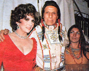The late Gina Lollobrigida beside Iron Eyes Cody and his girlfriend, Sandy Red Hawk. 

