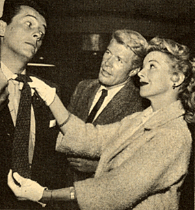 Robert Horton watches as Nan Leslie tries out a tie for Jack Kelly. This photo was just before Kelly became Bart Maverick and Robert Horton starred on “Wagon Train”.