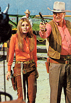 Raquel Welch seems a mite gunshy alongside John Wayne. 